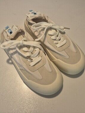 Curious Cream and Off-White Low-Top Sneakers